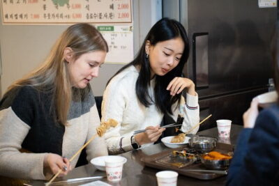 Hidden Stories & Flavors Market Food Tour - Your tasting lineup: dumplings, fish snacks, hot dog, and spicy rice cake